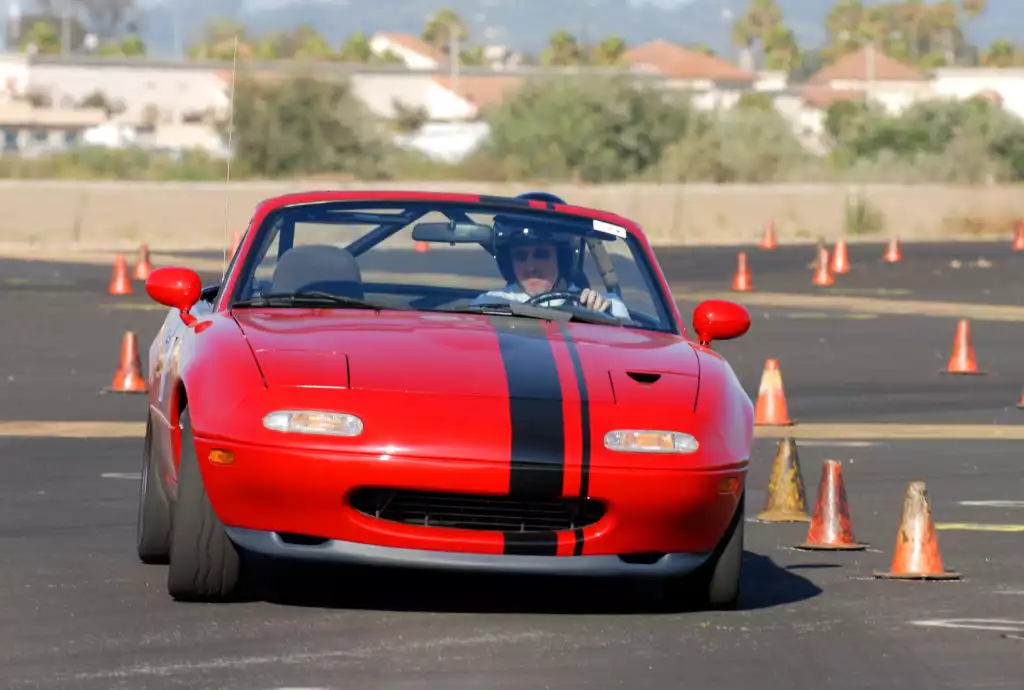 Red Mazda Miata On Track With Cones