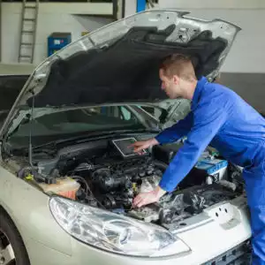 mechanic checks the car engine area after getting p3401 code