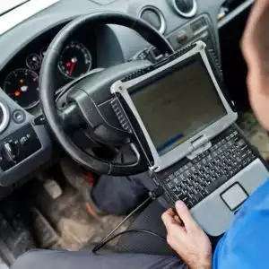 mechanic holding laptop