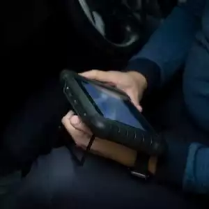 mechanic checking obd scanner