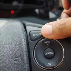 cruise control button located at car steering wheel