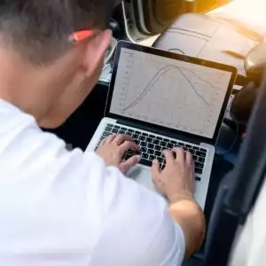 using a computer to fix car