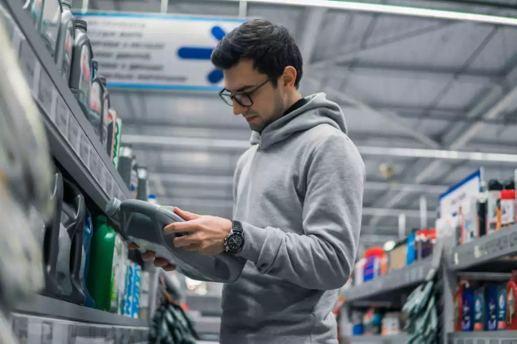 man looking for an engine oil for his car