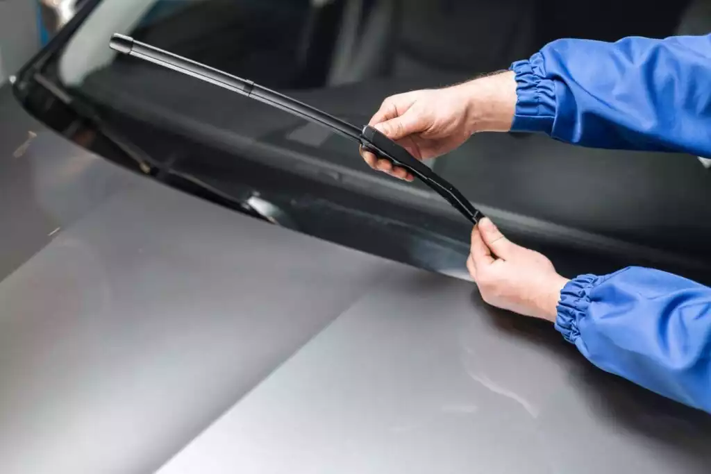 mechanic checking wiper blade