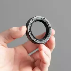 hand holding a camshaft seal