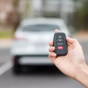 hand holding a key fob