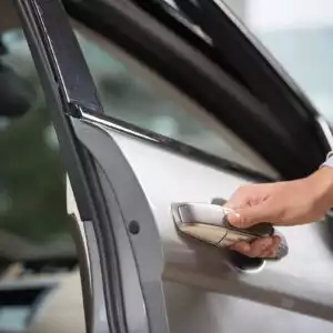 man holding a car door handle