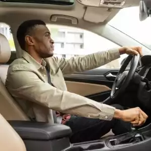 man with a shaking steering wheel