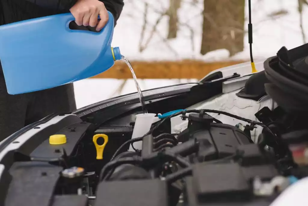 pouring car windshield washer fluid homemade