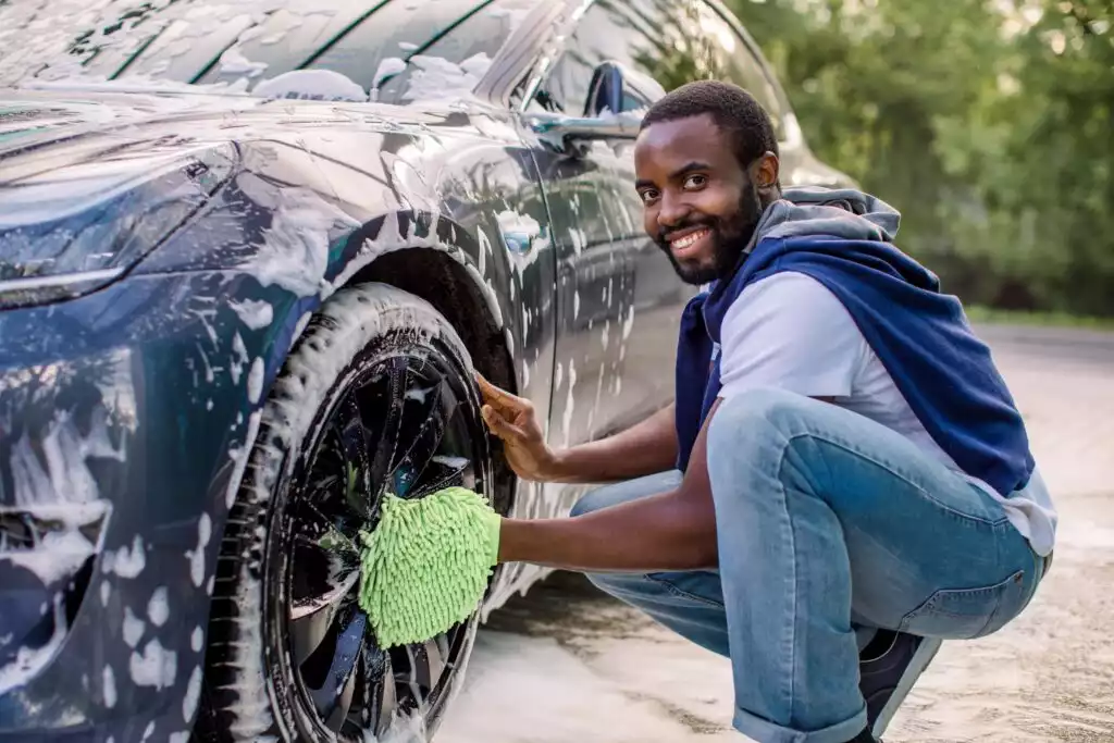 man washing his car outdoor