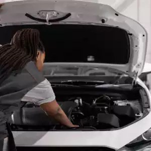 mechanic checking car with p1604 code