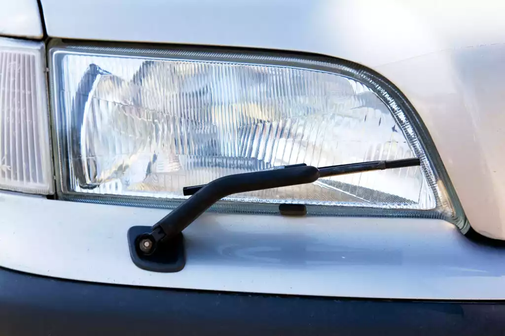A,Headlight,With,A,Wiper,Detail,On,A,Car