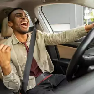 driver listening to music with speed sensitive volume active