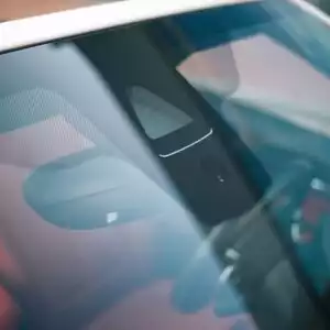 close up shot of a car windshield and rain sensor