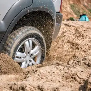 car stuck in deep mud
