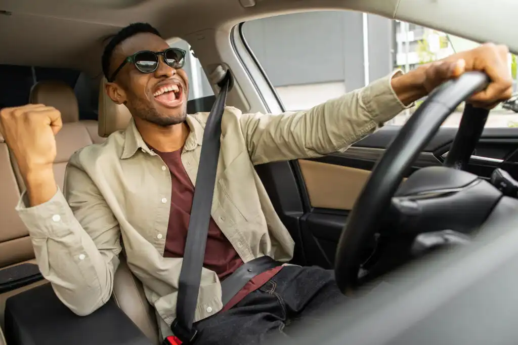 man driving while listening to music