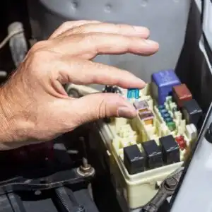 hand removing an automotive relay