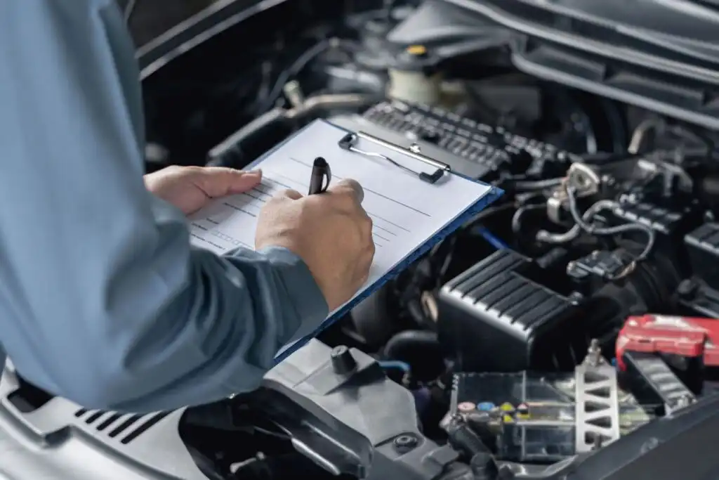 mechanic doing maintenance checklist
