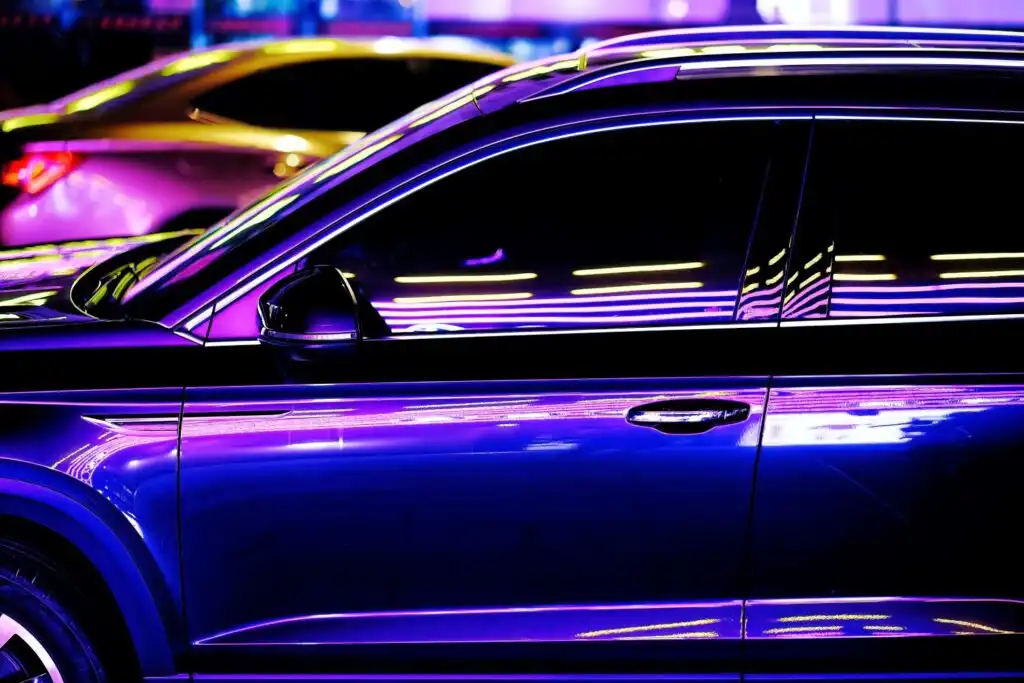 close up shot of a neon violet car