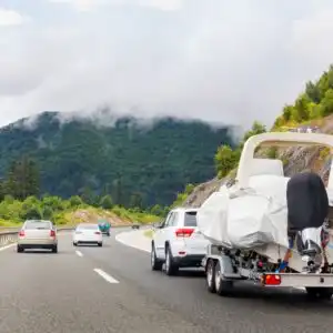 vehicle towing a trailer on a highway