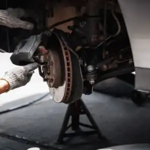 mechanic adjusting braking assembly