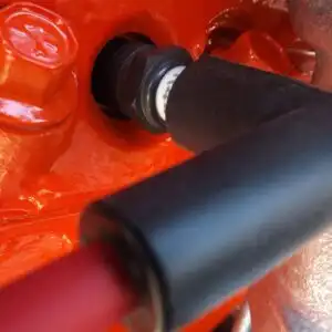 image of a spark plug and boot with wire