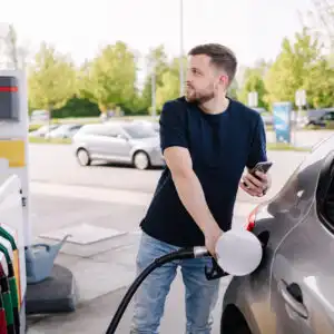 man filling car with e15 gasoline