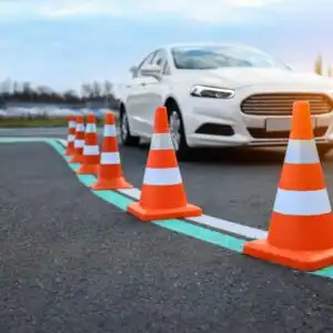 white sedan with cones