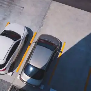 two vehicles parked in a parking lot
