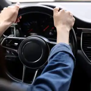 driver holding the steering wheel