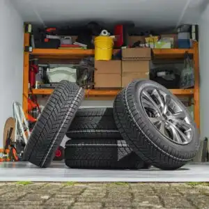 home garage with a pile of tires and other tools