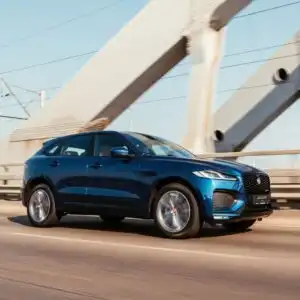 jaguar f pace driving on a bridge