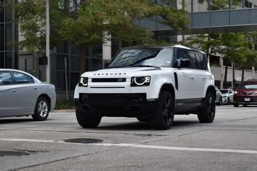 land rover defender in a city