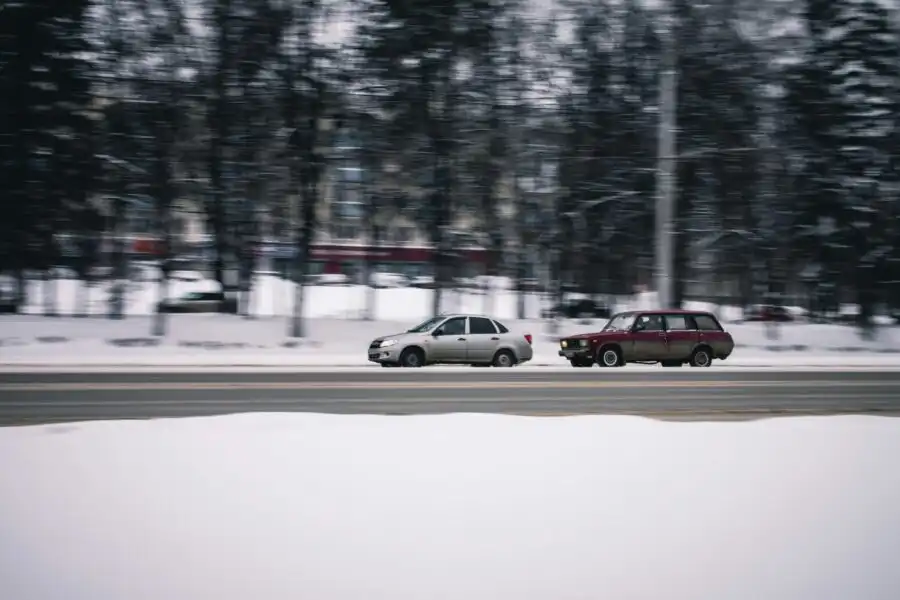 a car aboout to overtake another vehicle from the left