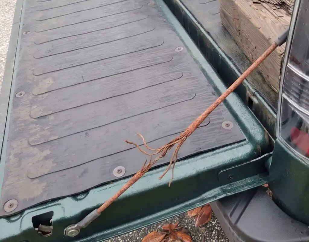 frayed rusted tailgate cable